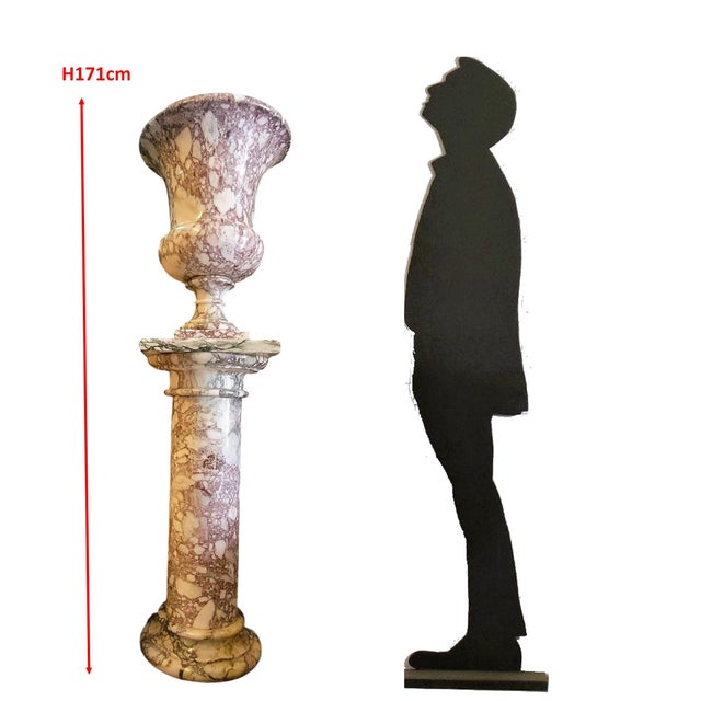 An imposing decorative set consisting of a large Medici-style vase resting on its matching marble (purple breccia)...