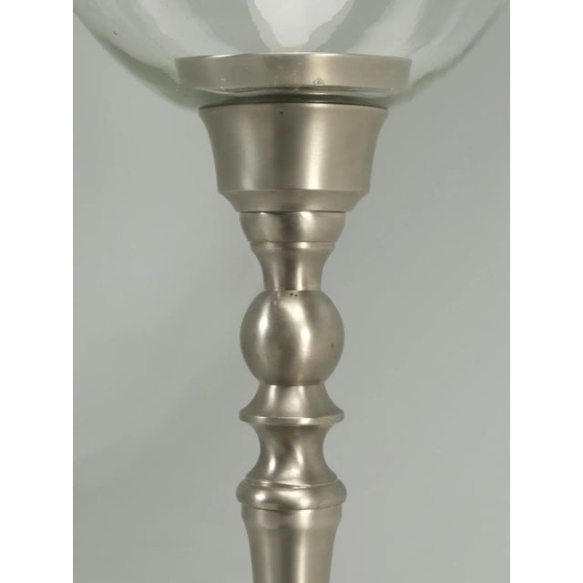 We purchased this rather large reproduction hurricane lamp in Europe and have used it as a store prop for a long time.