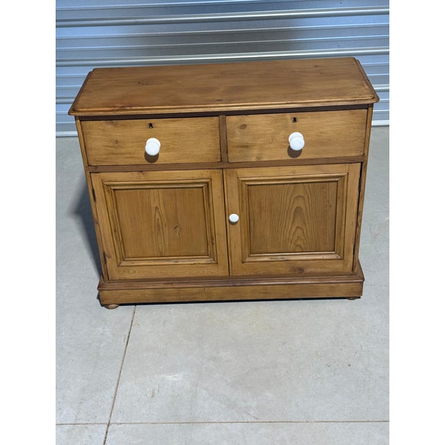 Antique Pine Cupboard with Two Drawers and Porcelain Knobs From England We liked this cupboard because it could be used in...