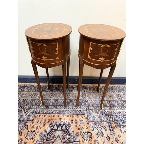 A lovely pair of French style oval lockers with a brass and inlay finish, standing on long cabriole legs. Beautiful and...