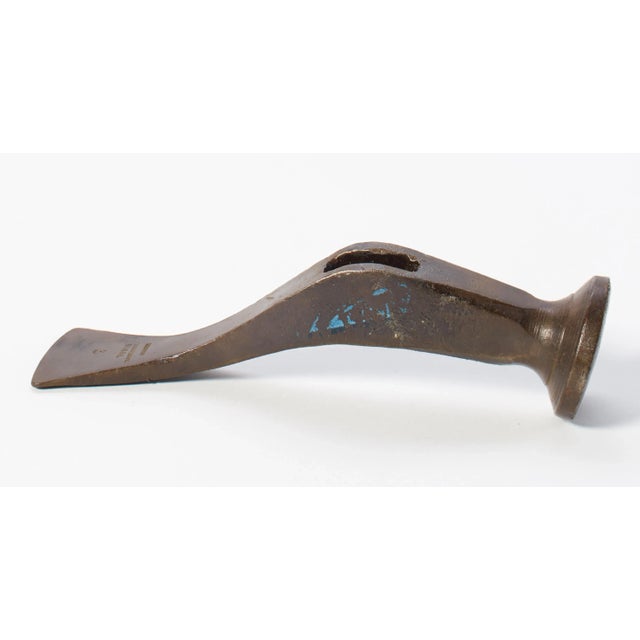 This hammer head makes a nice paperweight or decorative piece on the shelf. Could even be put back in use with the...