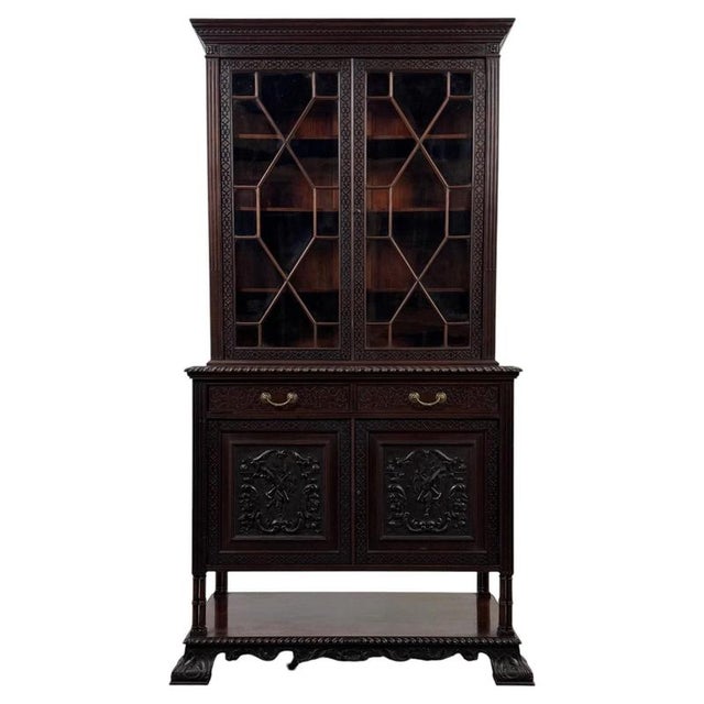 An exceptional 19th-century English display cabinet by the renowned cabinetmakers Maple & Co., finely crafted from...