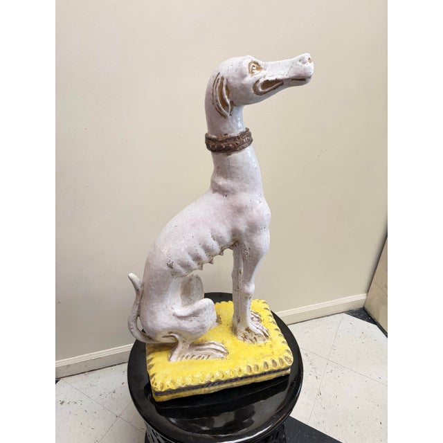 Charming terracotta greyhound statue. White glazed craquelure body with a stunning standout ribcage. Obedient in its...