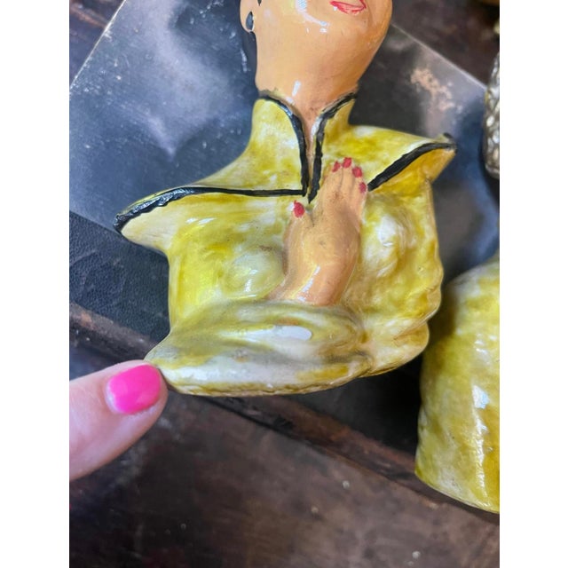 Fabulous pair of Asian chalkware busts, one depicting a woman and the other a man, both in traditional matching attire. A...