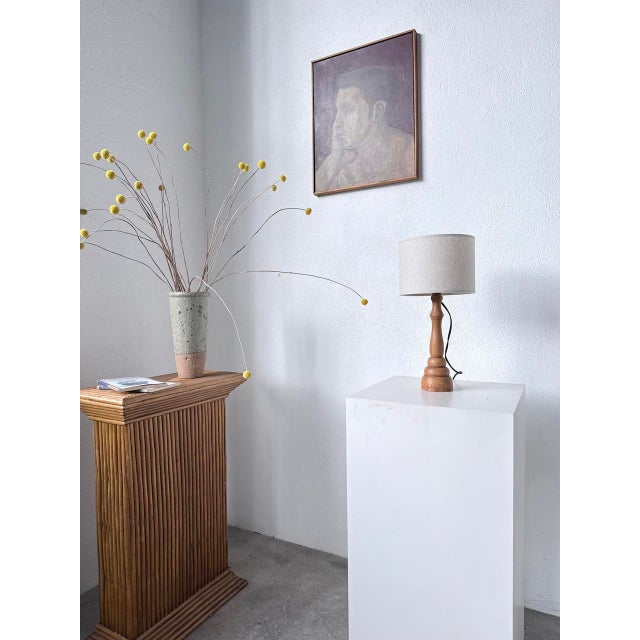 Vintage small solid oak table lamp from the 1950s. A unique piece, entirely hand-turned, with an elegant and timeless...