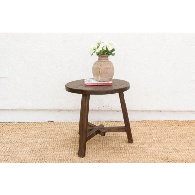 Discover the pure, unadorned beauty of natural materials with this magnificent reclaimed wood round end table. Measuring a...