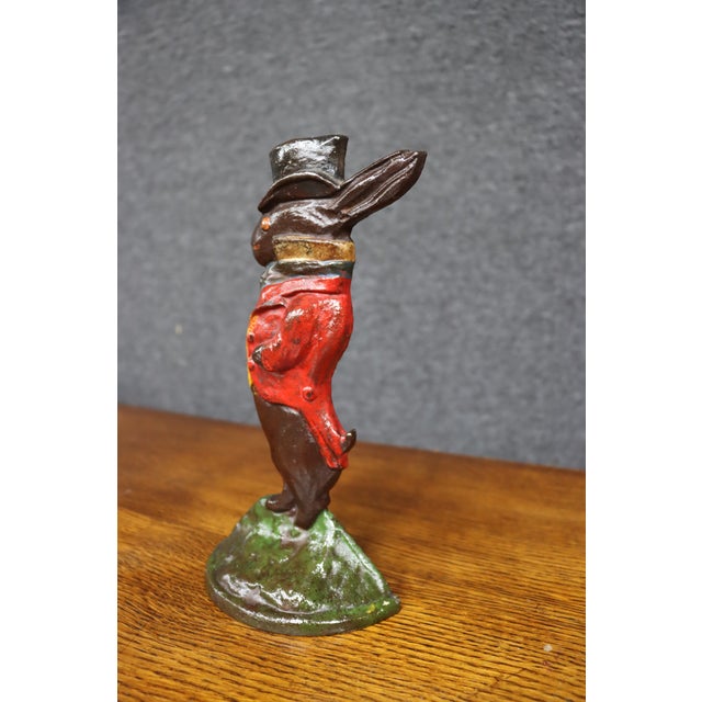 Original Albany Foundry cast iron rabbit doorstop, Model #94, dating to circa 1920. The whimsical rabbit is dressed in a...