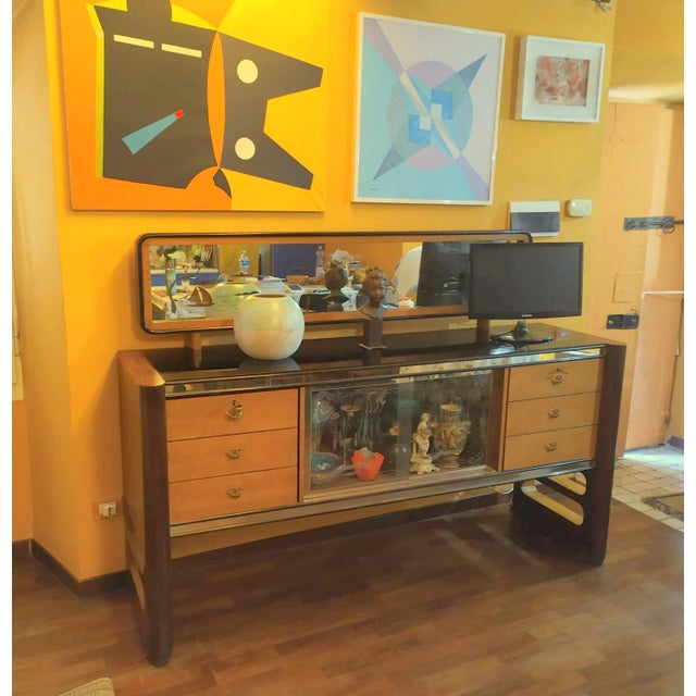 This rare sideboard are manufactured in Cantù by La Permanente Mobili Cantù, Palazzi dell'Arte around the 1940s. Designer...
