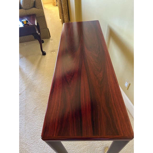 A beautifully crafted Danish modern console table, made in Denmark and dating to the mid-20th century. This piece features...