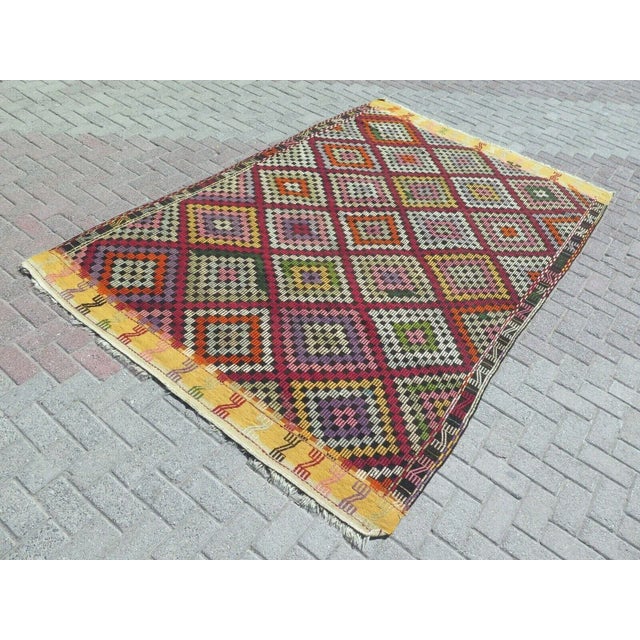 This beautiful, traditional vintage, flatweaved Turkish kilim is approximately 60 years old. It is handmade of very fine...