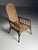 Thonet-style armchair. Made of bentwood. with a cane seat. In good condition! Adjustable back. Dimensions: 67W x 110H x 97H