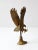 This is a vintage brass eagle sculpture. An eagle preparing to land atop a rock shapes this figurative sculpture. Lovely...