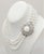 This is part of Chairish’s Costume Jewelry assortment. Early 1950s rhodium plated 3-strands of white beads with clasp of...