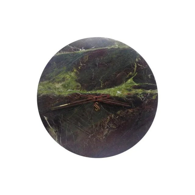 Discover timeless elegance with this Burgundy green marble clock with a polished finish. Its minimalist and modern design...