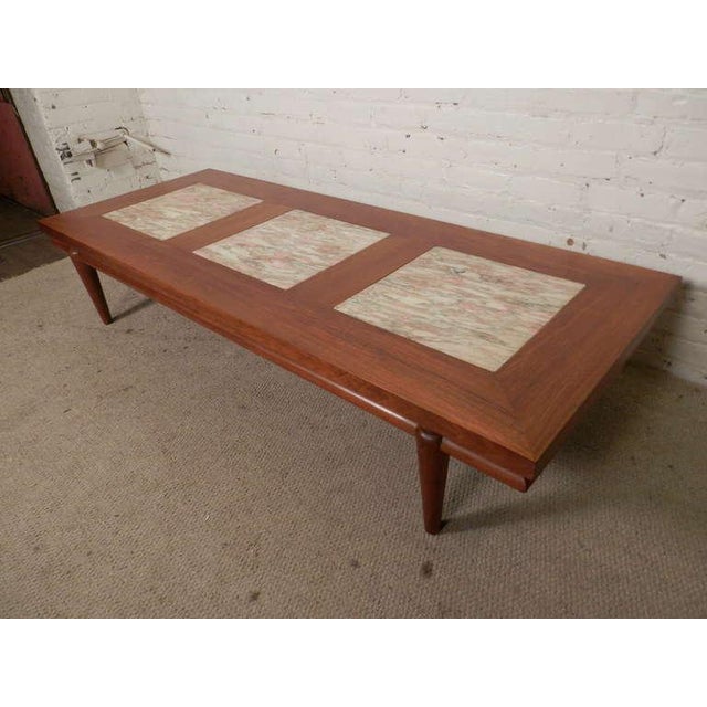 Large sofa table made of walnut grain with three thick marble inserts. Nice tapered legs, floating top and heavy, well...
