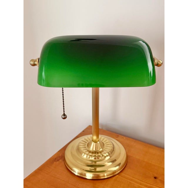 Beautiful banker's desk lamp with green Emeraldite shade and drawstring ball pull. A classic and traditional touch. Most...