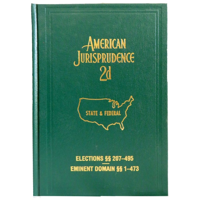Handsome collection of green, gold, and black legal bindings. Perfect to style a bookcase in a great room, home office or...