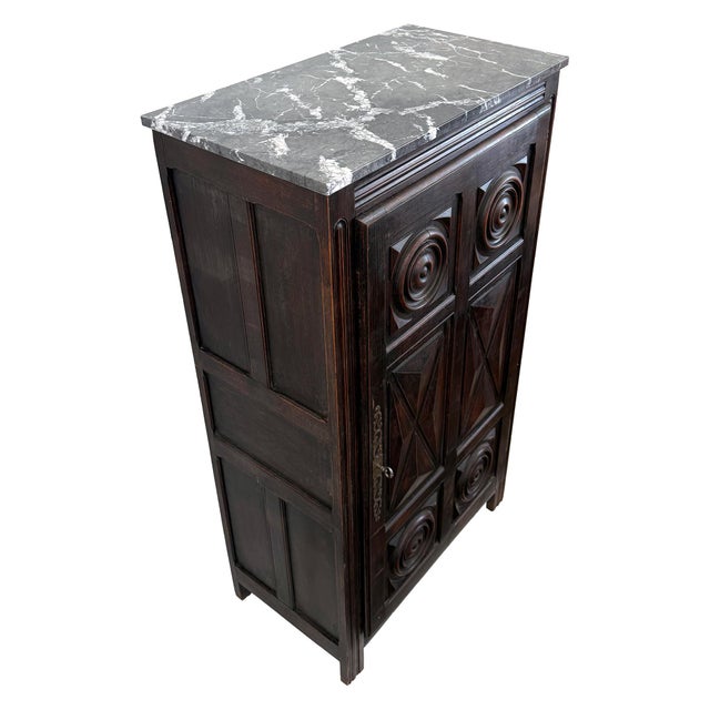 An impressive and elegant late 19th century Arts and Crafts wood cabinet with contemporary marble top. Austere,...