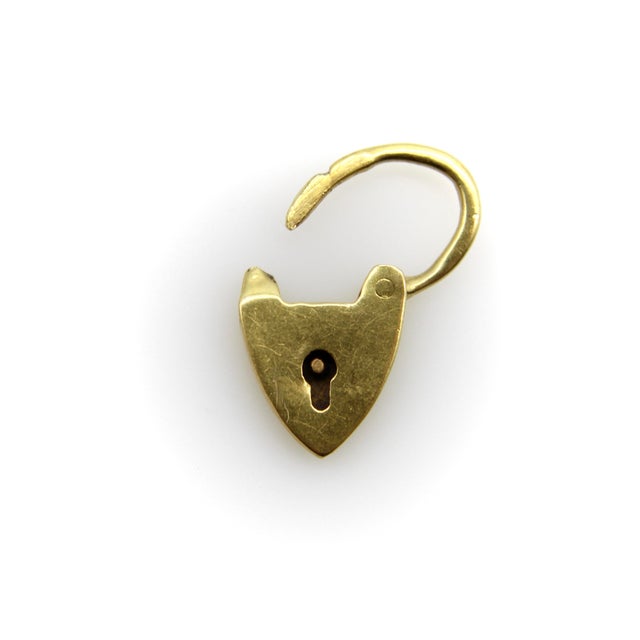 Circa the 1900’s, this tiny 9k gold padlock charm is one of the smallest that we’ve seen. Shaped like a heart, it is a...