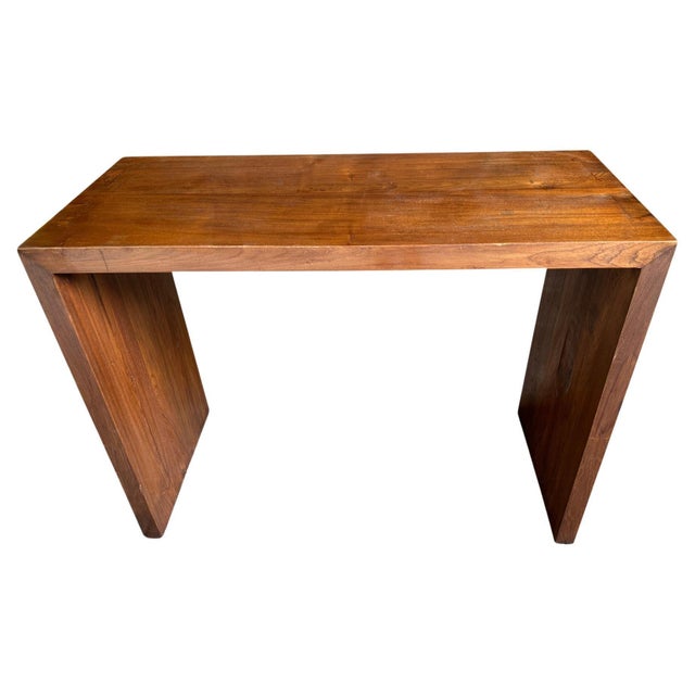 Minimalist console table hand made from reclaimed teak wood with dovetail detail on the leg. Each panel is two inches...