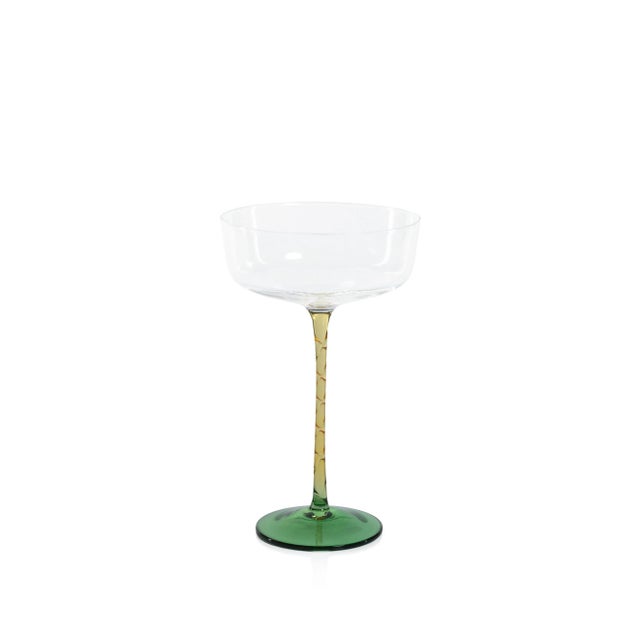 This set includes four cocktail glasses with an elegant design, perfect for enhancing the drinking experience of your...
