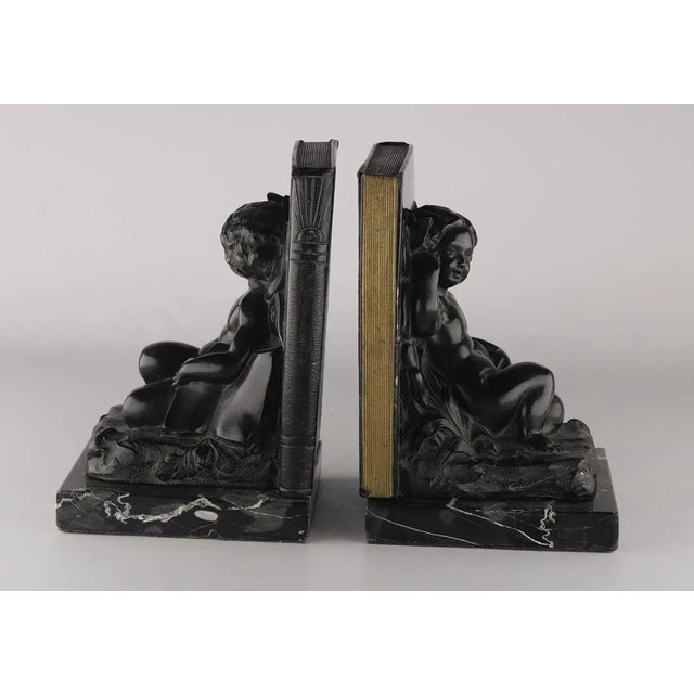 Art Deco Set of 2 Early 20th Century French Art Déco Zamac Winged Cherub/Fairy Child Bookends With Marble Base For Sale - Image 3 of 7