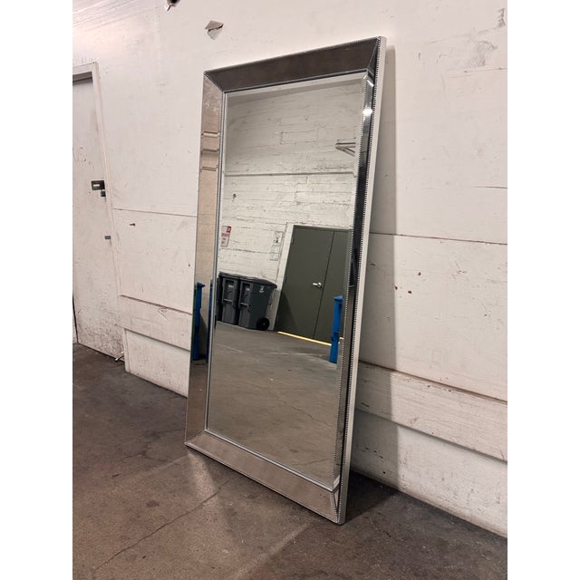 Design Plus Gallery presents a Beaded Floor Mirror from Bassett Mirror Company. The wood frame has a silver leaf surface...