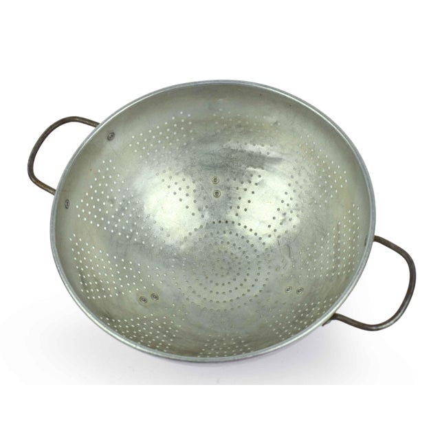 Elevate your farmhouse kitchen or eclectic countertop with this charming set of two vintage aluminum colanders. This duo...