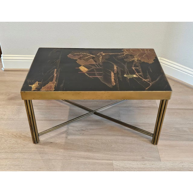 A striking French Mid-Century Chinoiserie low table in the manner of legendary Parisian designer Maison Jansen. Featuring...