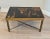 A striking French Mid-Century Chinoiserie low table in the manner of legendary Parisian designer Maison Jansen. Featuring...