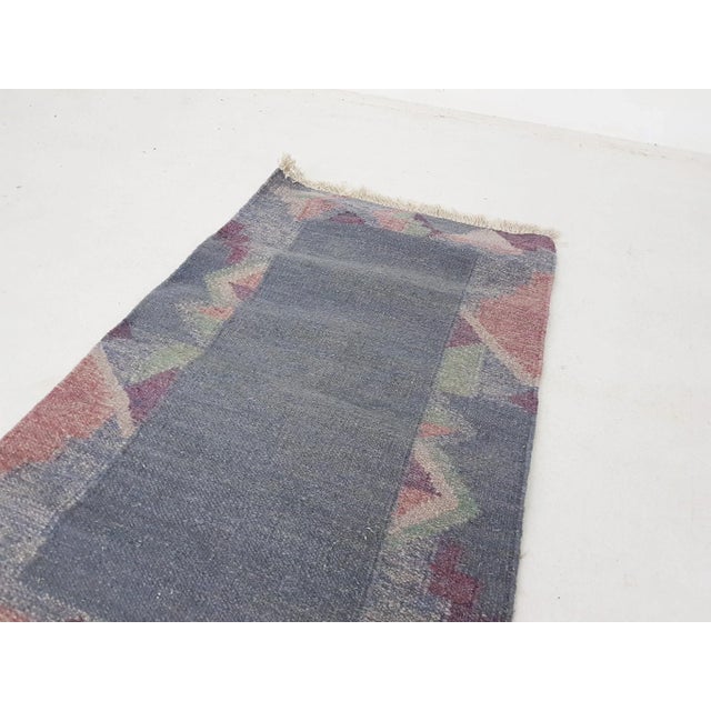 Vintage Indian Woolen Rug, in Good conditions. Designed 1950 to 1959 This piece is attributed to the mentioned...