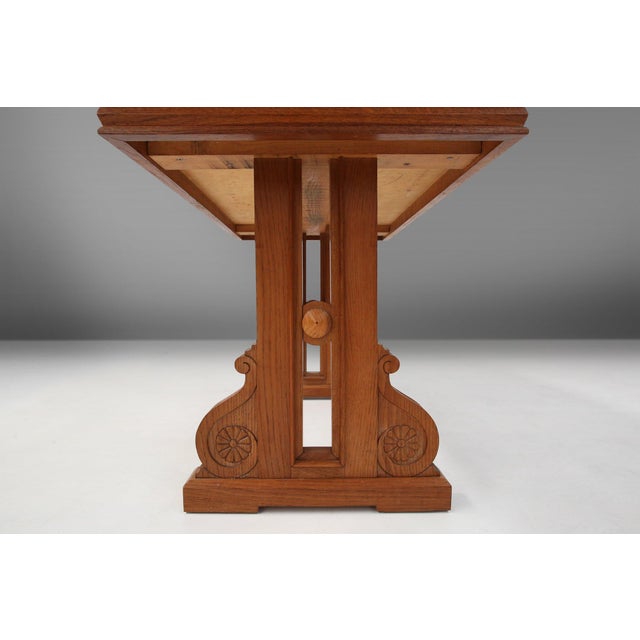 A fine example of Belgian Art Deco craftsmanship, this 1940s oak coffee table. It combines architectural clarity with...