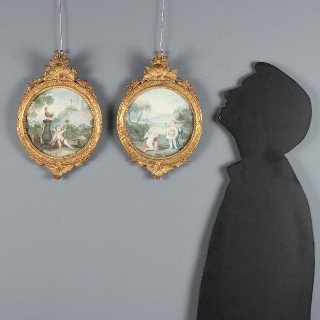 Oil paintings on circular paper. The protagonists of the compositions are cherubs displaying symbols of the Passion of...