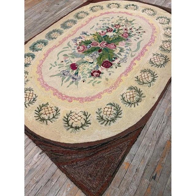 This late 19th-century American Hooked Rug reflects the domestic artistry of the 1880s, hand-knotted in premium wool to...