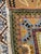 An oversized hand-knotted Oriental rug featuring an uncommon Art Nouveau-inspired floral design. The warm camel field is...