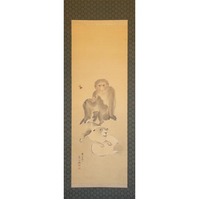 Excellent large antique Japanese silk scroll painting "Monkeys and Puppies" by Nakajima Kayo. The signature and seal read...