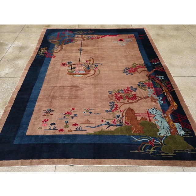 This mid-20th century Chinese Art Deco rug, presents a striking composition that seamlessly blends traditional Chinese...