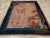 This mid-20th century Chinese Art Deco rug, presents a striking composition that seamlessly blends traditional Chinese...