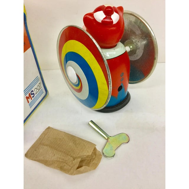 This is direct from the factory that produced these toys in the 1940’s. The key is in a paper bag and winds him up and he...