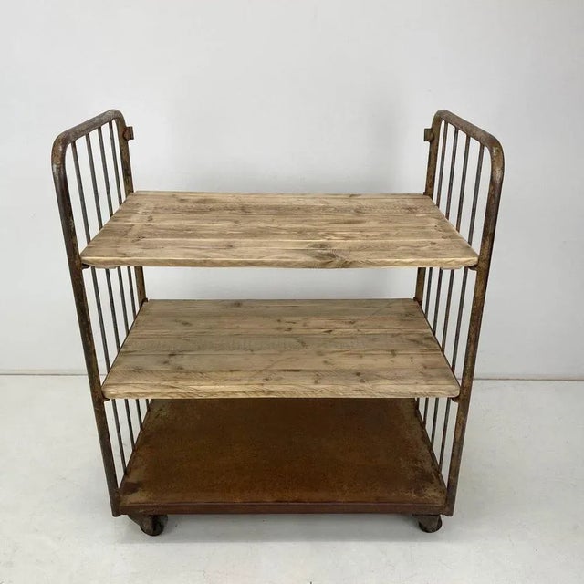 Industrial 3 shelves cart made of iron and wood. All parts are original. The entire cart has been thoroughly cleaned and...