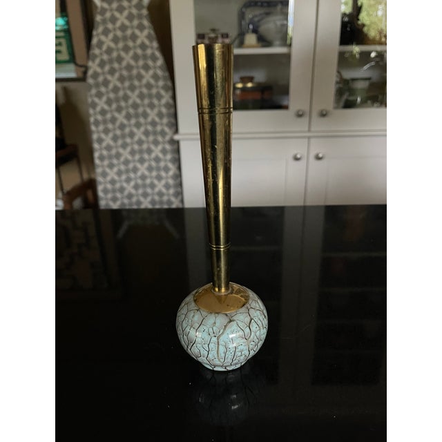 Hand-painted Delft Holland ceramic bud vase with gold-colored stem. The vase stands 7 1/2 inches high and the widest part...