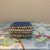 An enchanting vintage mid-century miniature trinket box, meticulously hand-decorated in the tradition of folk-art...