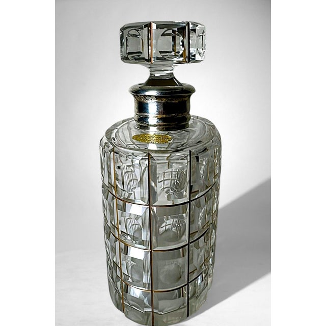 Elegant Italian cut crystal decanter, finely ground and polished, enhanced by a 925 sterling silver collar crafted by the...