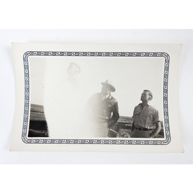 Circa 1940's black and white snapshot photograph of two men with double and over exposure of one man. A quirky vernacular...
