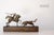 Incredible vintage brutalist bronze sculpture of a picador battling a bull on a wooden base. This piece is rustic and...