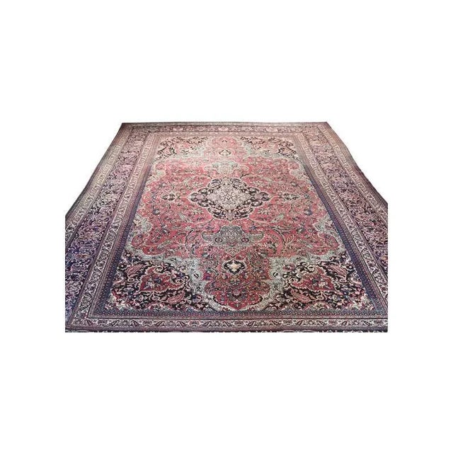 ACTUAL SIZE: 12’0″ x 17’0″ PRIMARY COLOR: Rust / Navy AGE: Antique MATERIALS: Wool FOUNDATION: Cotton PRODUCTION:...