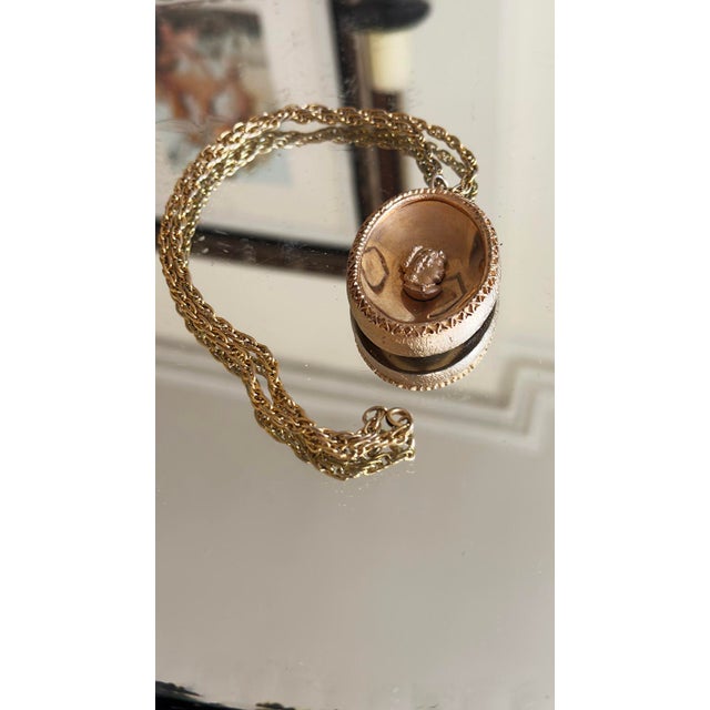 Vintage cameo necklace in a Victorian / Edwardian revival style. The round pendant features a raised portrait in relief...