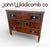 A distinguished 1981 John Widdicomb chest of drawers crafted in Grand Rapids, Michigan. This neoclassical-inspired design...