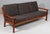Juul Kristensen three seat sofa in teak. Cushions upholstered with grey wool fabric. Made by Juul Kristensen in the 1960s....