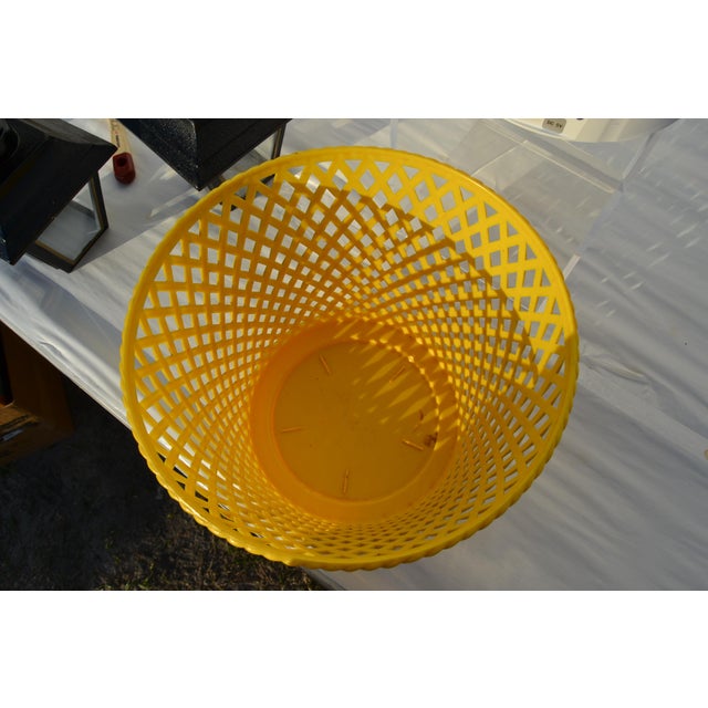 Faux basketweave wastebasket. Made of plastic. No breaks or cracks.